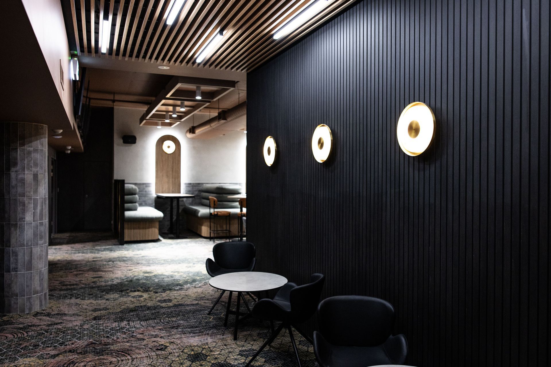 Screenwood's PANELS in Groove 50 line the walls to create a sophisticated yet relaxed atmosphere.