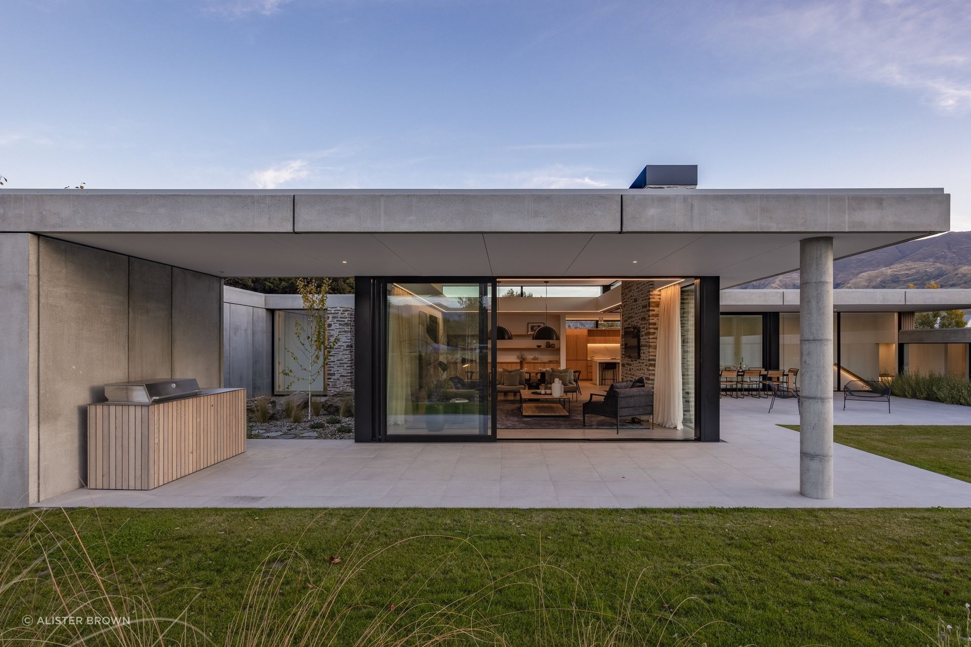 Beneath the concrete veneer, a layer of timber framing is hidden, filled with insulation to warm occupants.