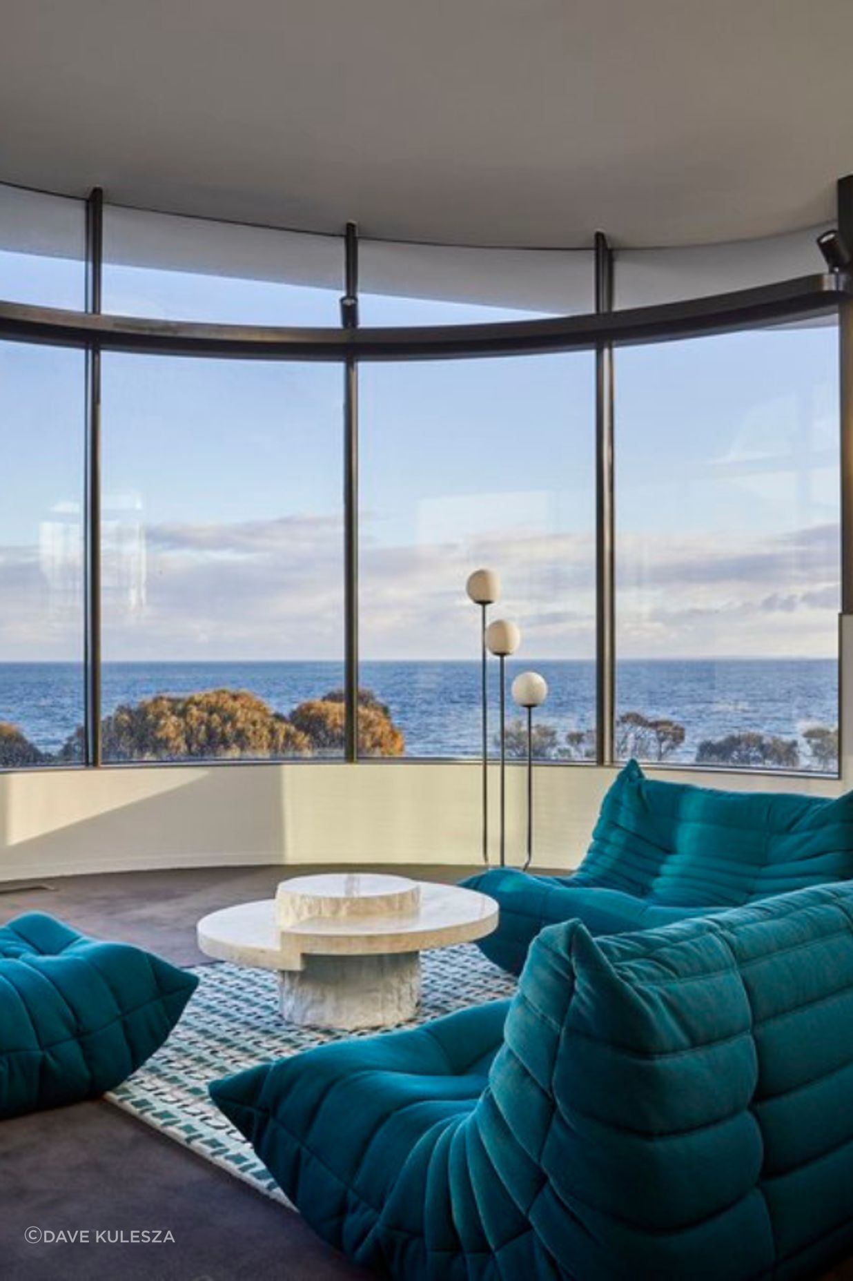 Curved windows provide 270 degree views of the bay.