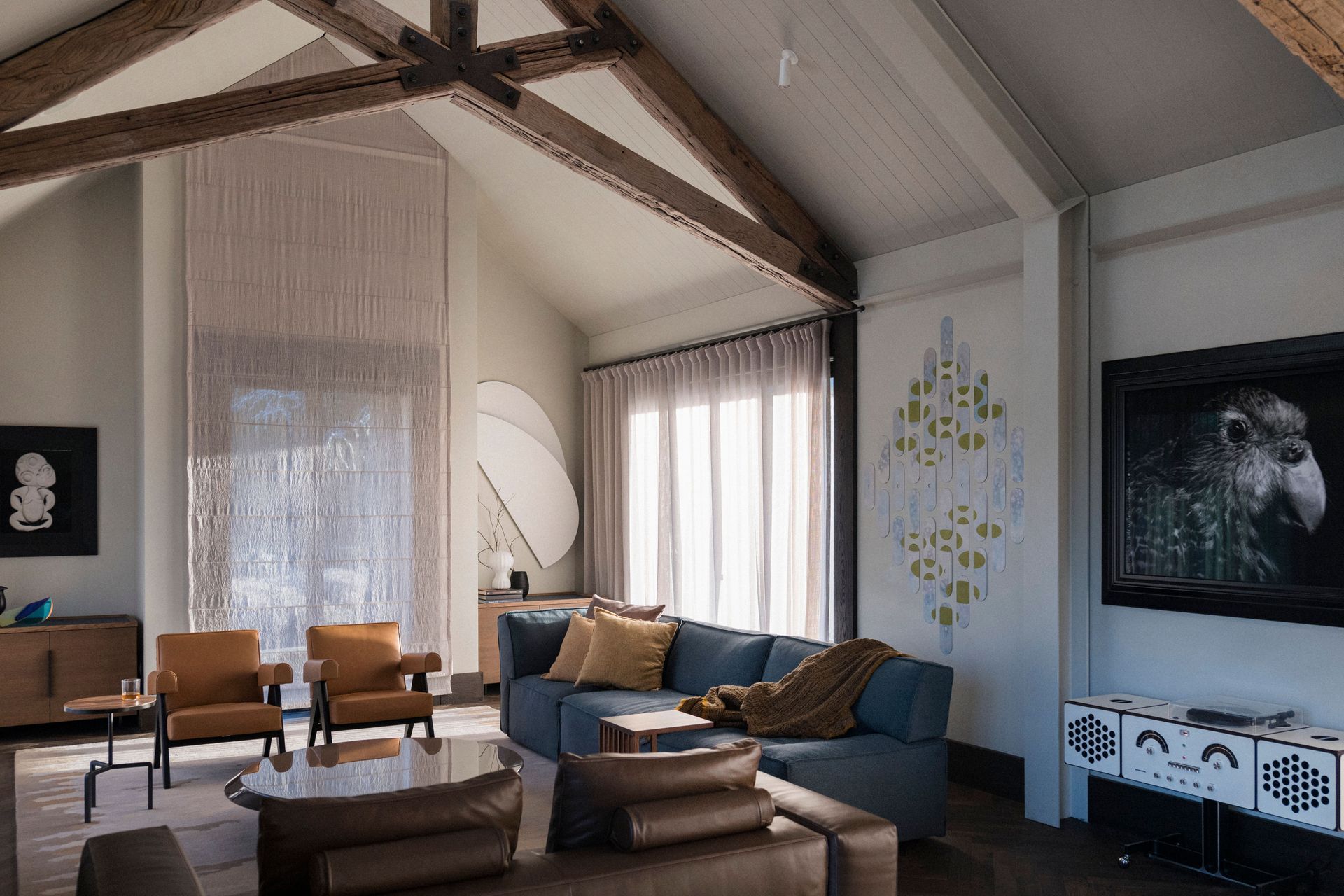 In the interior, a central fireplace was removed and rebuilt on the side of the space, to allow light in and blank walls to showcase the couple's many artworks.