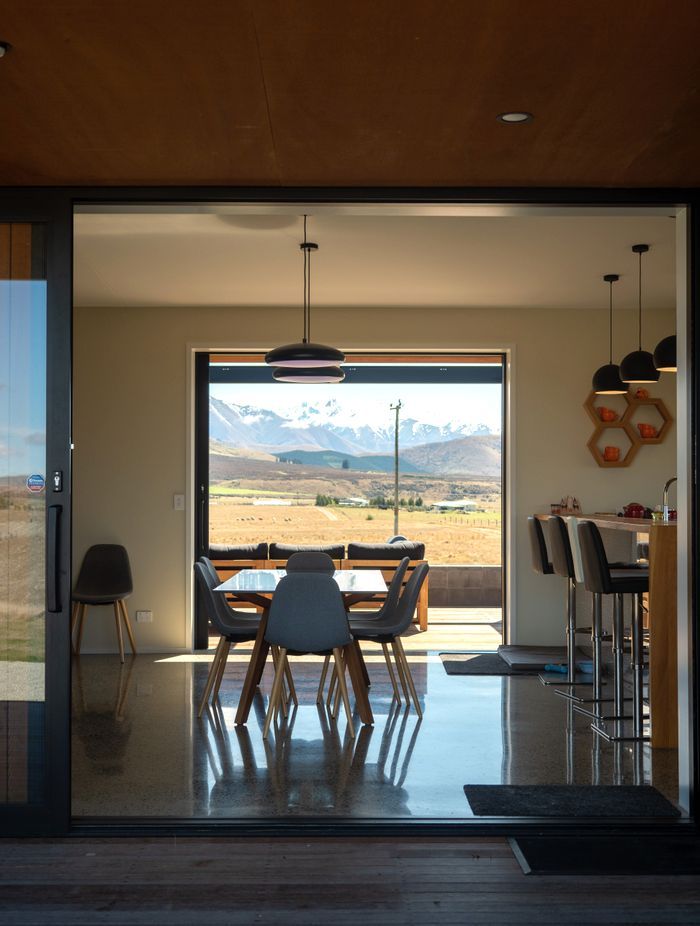 The view through the living area. “The architectural experience is quite a long journey,” says Beth. “It's about getting to know clients really well, early on, so we spent the time up front actually getting to know the clients and their unique needs and lifestyles.”