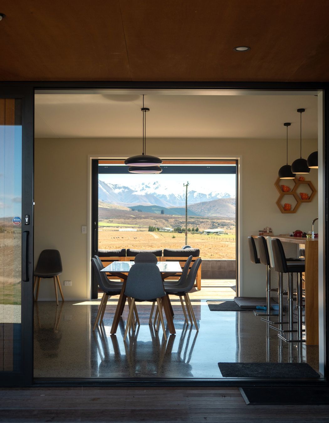 The view through the living area. “The architectural experience is quite a long journey,” says Beth. “It's about getting to know clients really well, early on, so we spent the time up front actually getting to know the clients and their unique needs and lifestyles.”