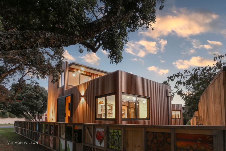 The client's friends, family, neighbours, builders and subcontractors each created works of art out of the building waste, which were then inserted into the fence panels.