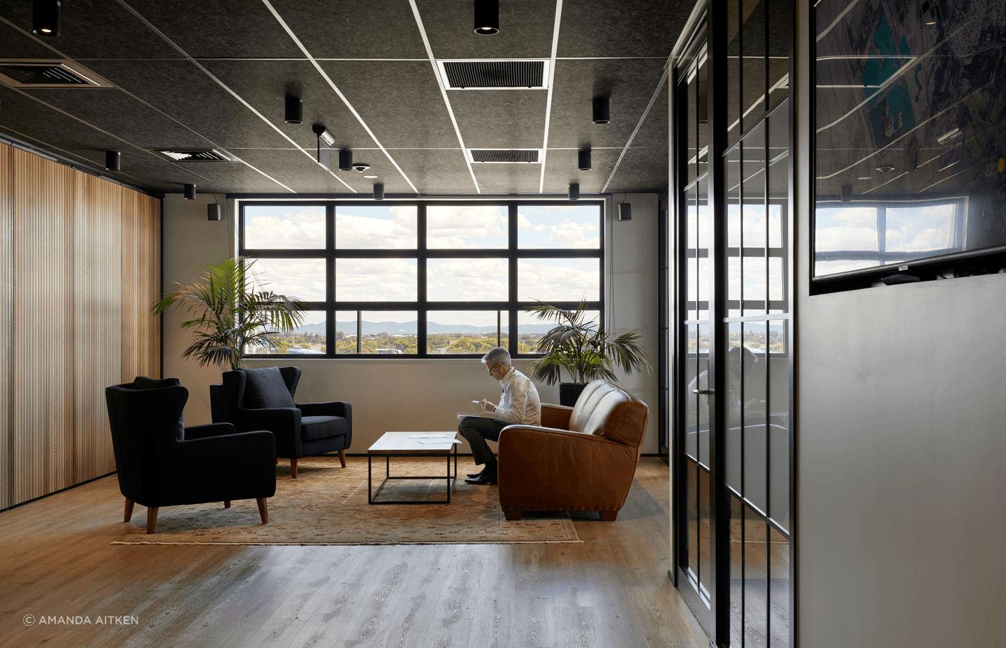 Timber elements amd plush rugs were introduced to soften the hard surfaces.