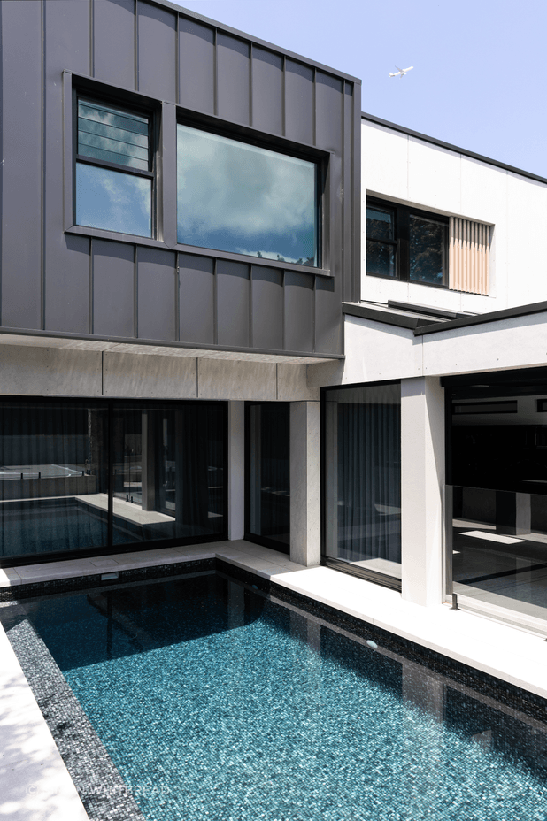 The pool is easily accessed from the indoor-outdoor entertainment area.