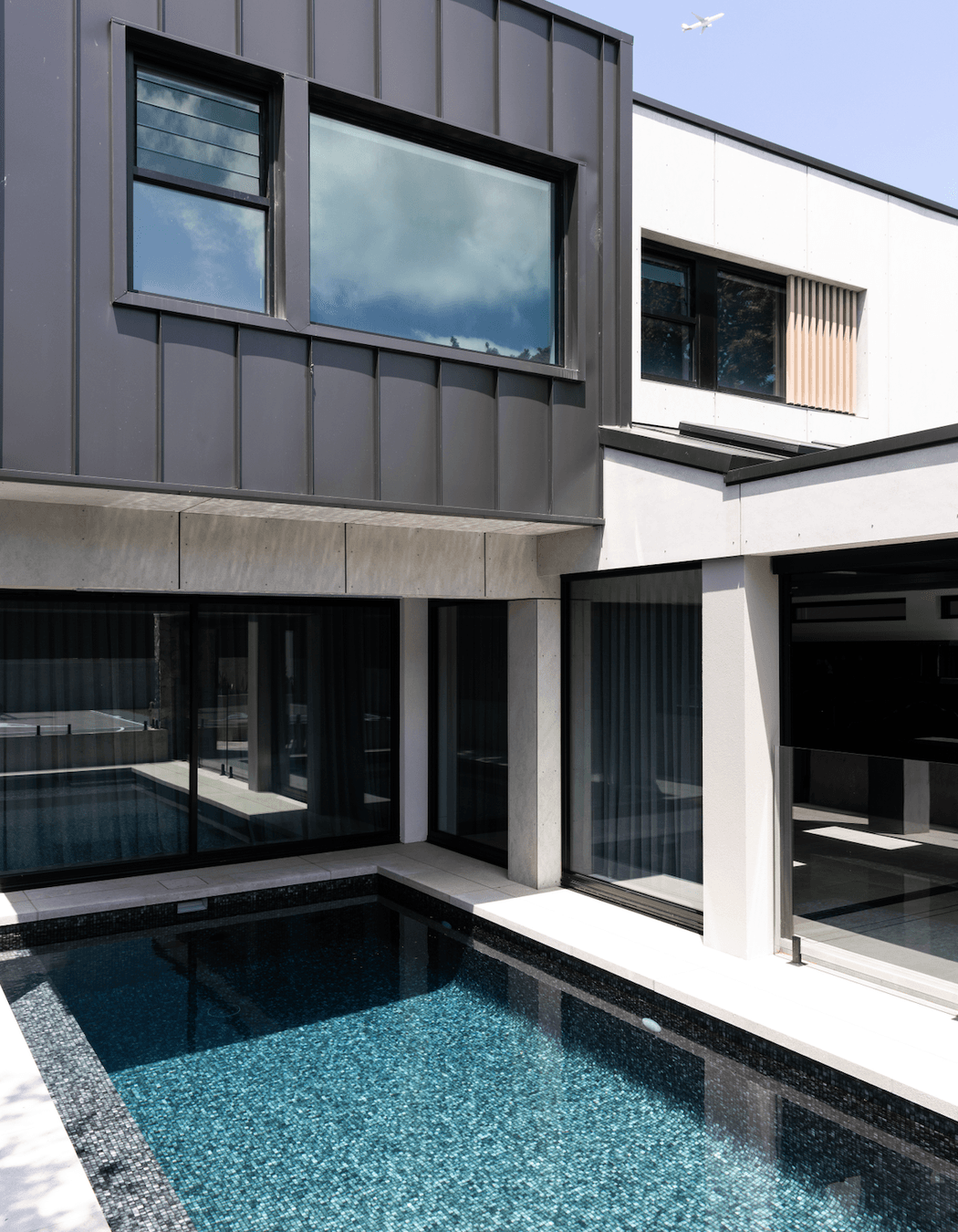 The pool is easily accessed from the indoor-outdoor entertainment area.