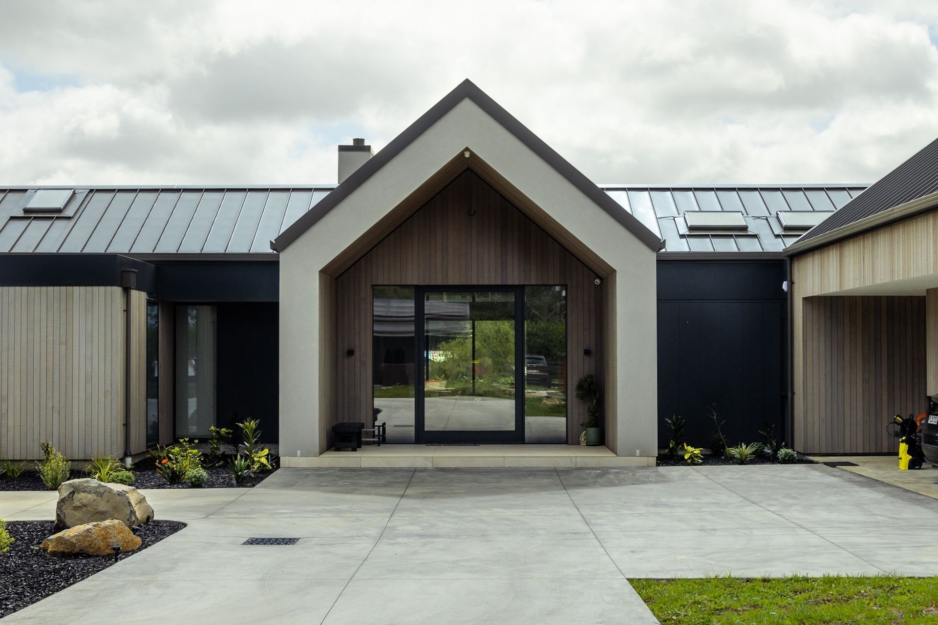 The forecourt features carefully considered planting.