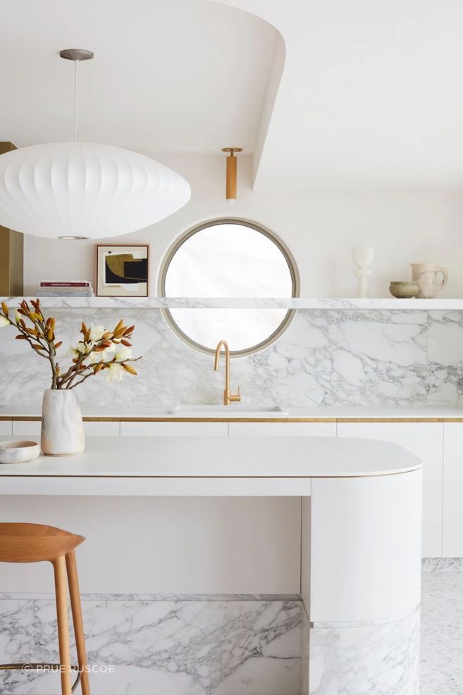 The round window in the kitchen is a reference to the home's original windows.
