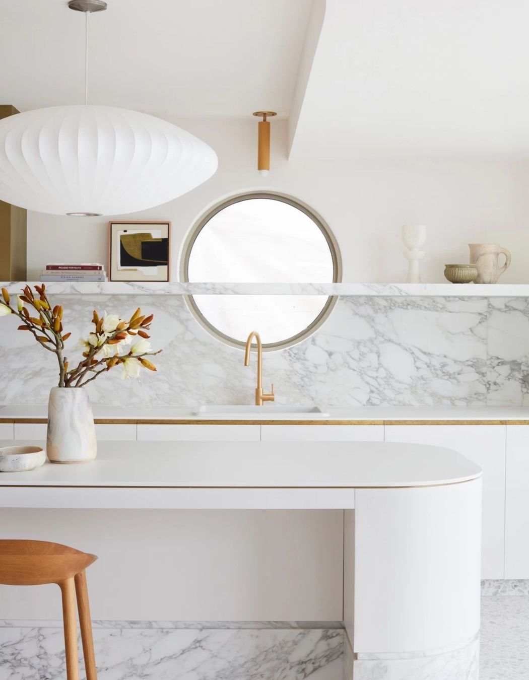 The round window in the kitchen is a reference to the home's original windows.