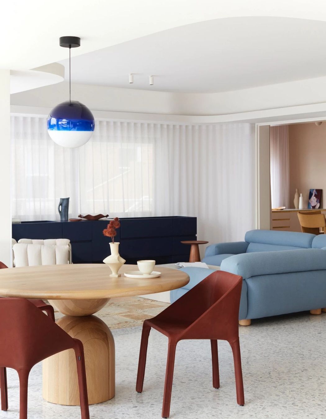 The terrazzo floor acts as a gorgeous canvas for the furniture to deliver a contemporary twist on 1980s style.