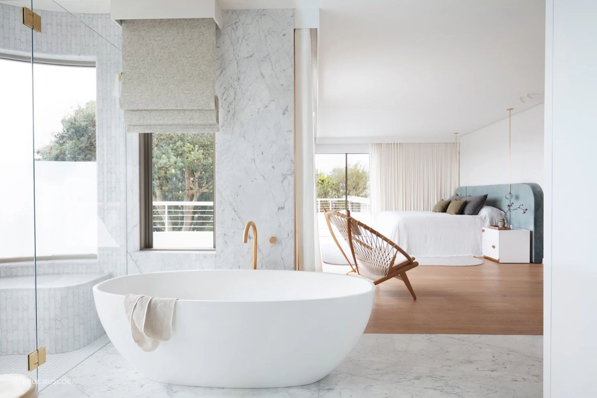 Open and airy, the main bedroom suite is a parents-only haven.