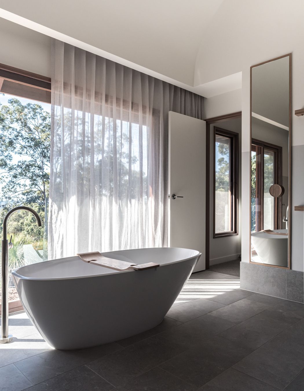 Natural lighting falls onto the bath tub | Photography: Emma Bourne &amp; David Chatfield