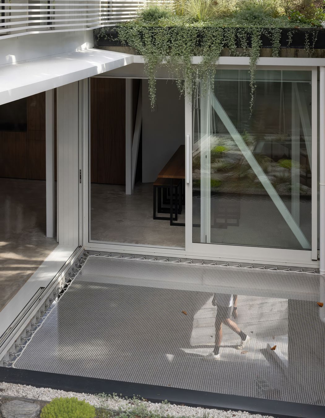 Playful interior elements include stretches of hammocks.