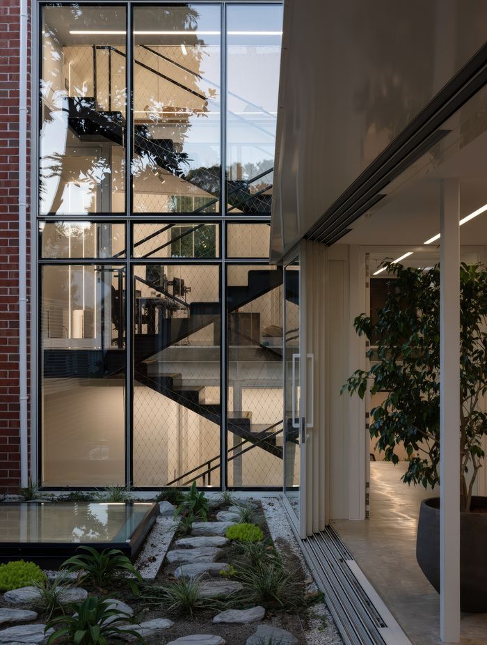 Inside the villa, a new stairway links the original building to its new extension.