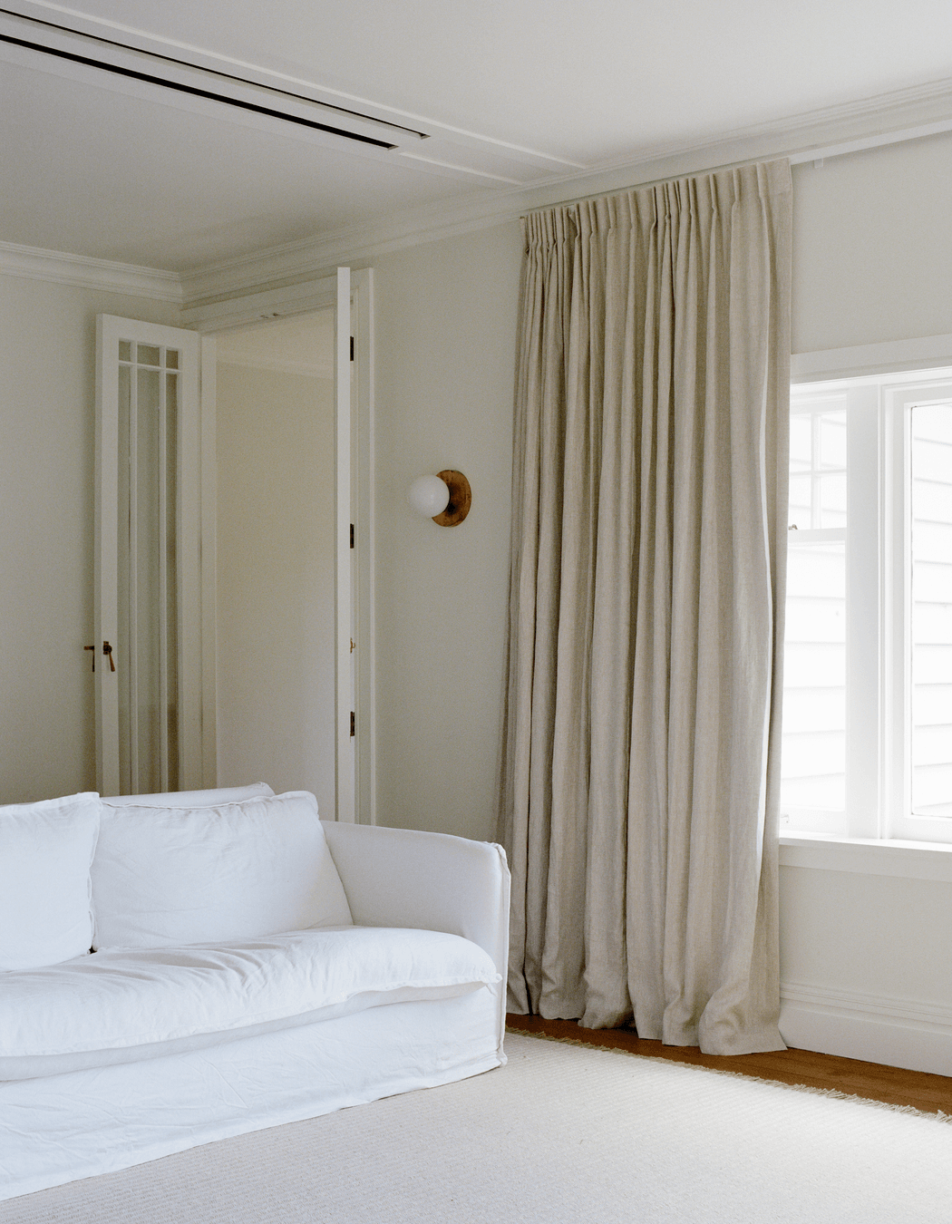 The lounge space features the dreamy natural palette the family loves.