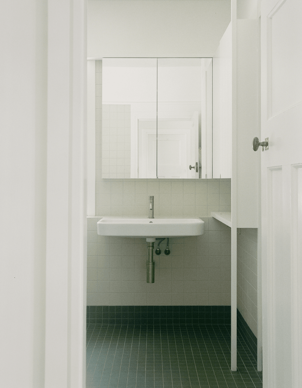 The family bathroom received a muted, classic upgrade.