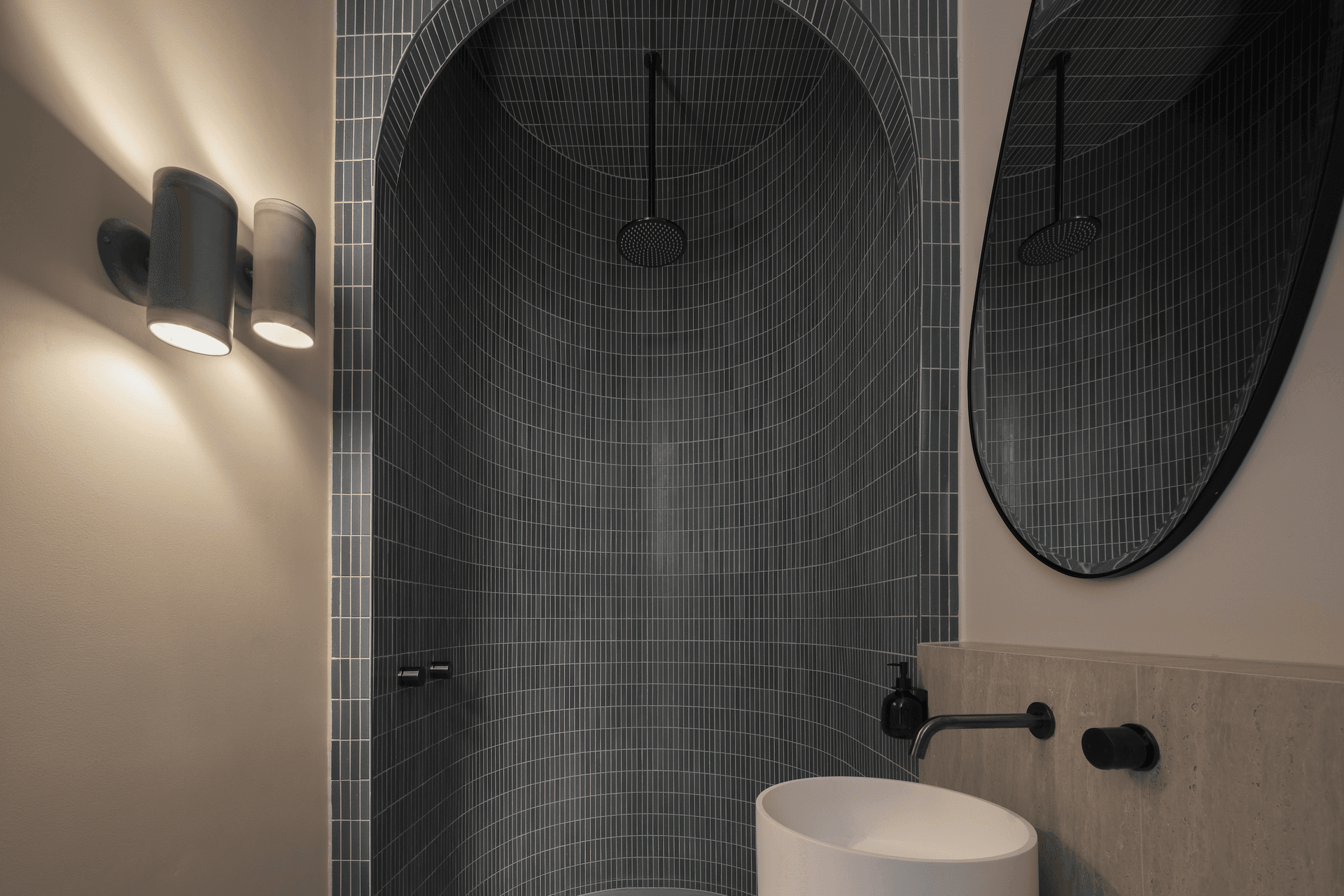 Handmade tiles add colour and texture to the downstairs bathroom.