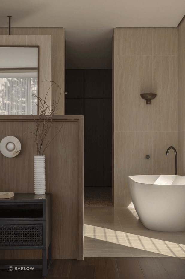 Taking cues from the ground floor, the master suite is open-plan.