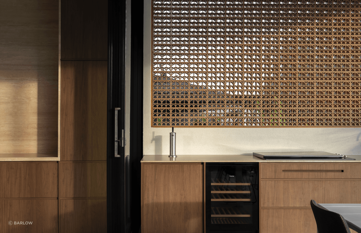 The outdoor kitchen is an extension of the main kitchen with premium appliances for next-level entertaining.