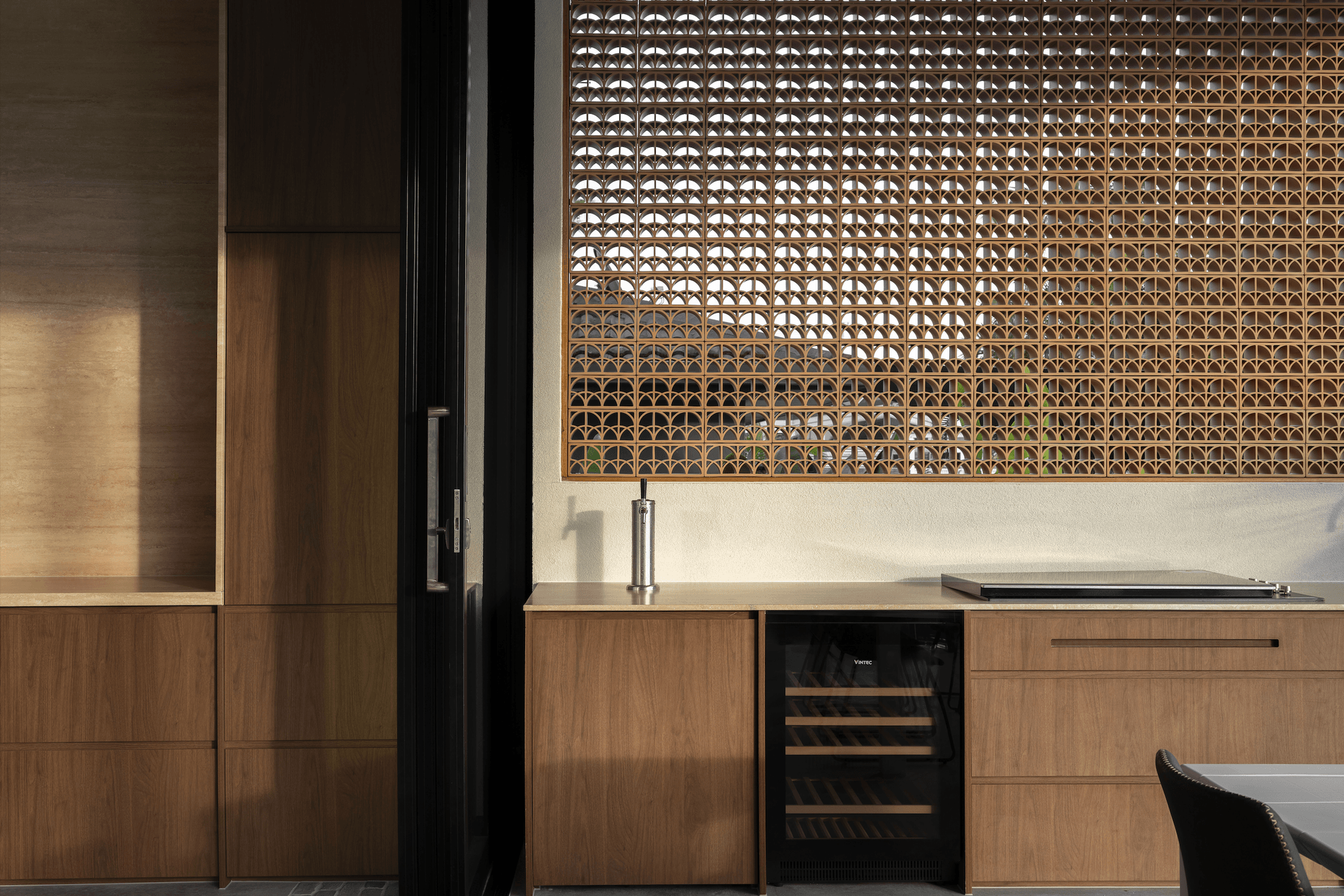 The outdoor kitchen is an extension of the main kitchen with premium appliances for next-level entertaining.