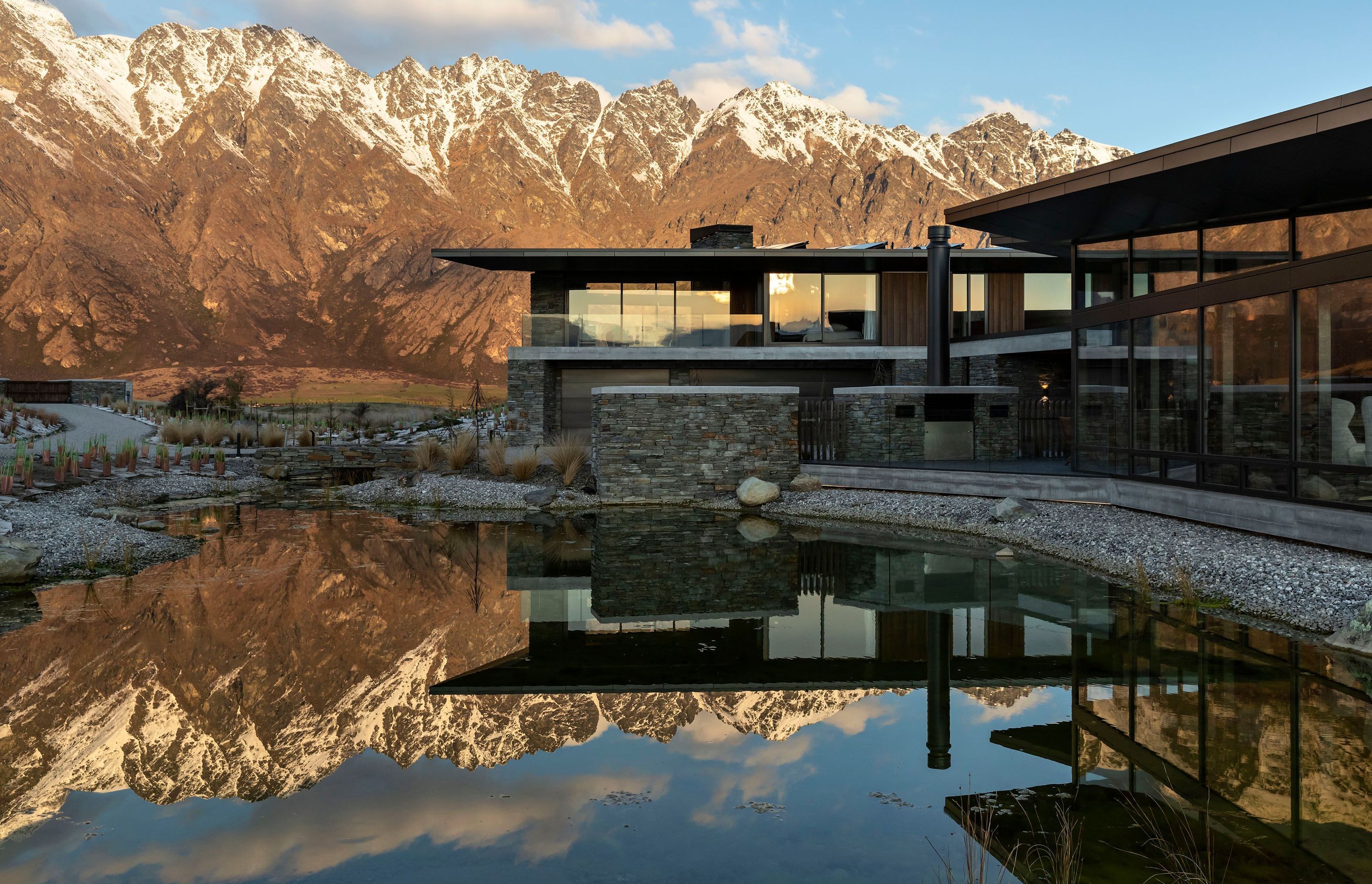 A view from the reflection pool of Hidden Island Retreat and the surrounding mountain ranges.