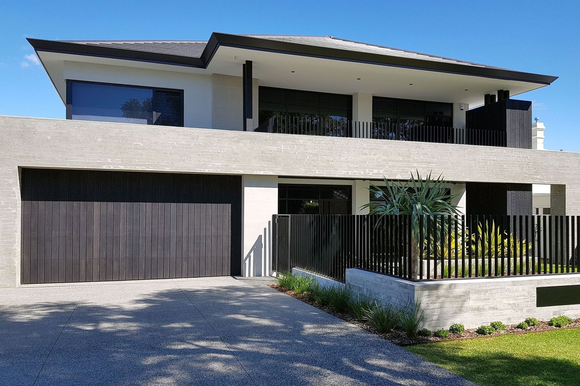 Composite material-clad garage door on a new build.