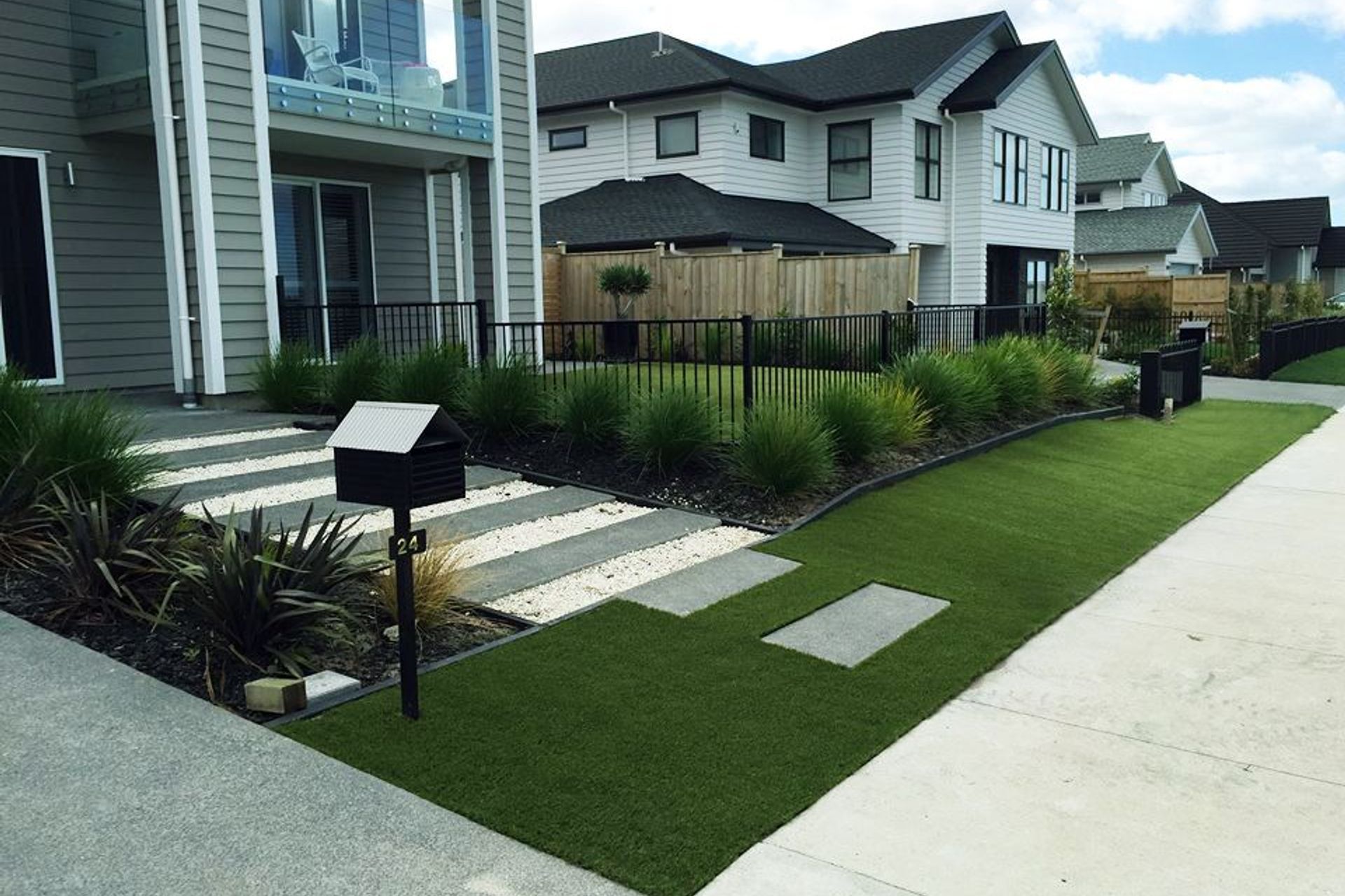 Artifical grass makes an easy and attractive entryway.