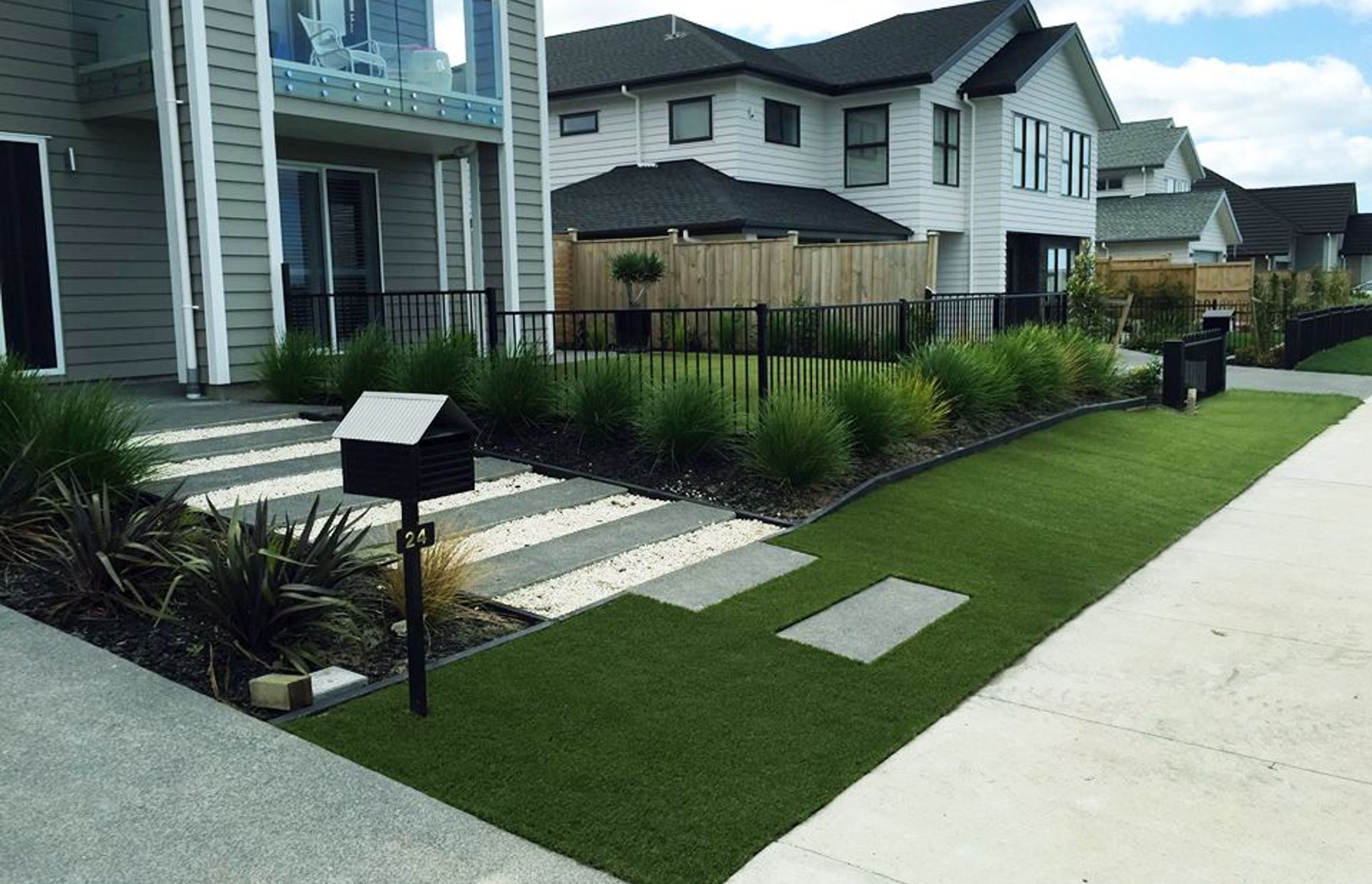 Artifical grass makes an easy and attractive entryway.
