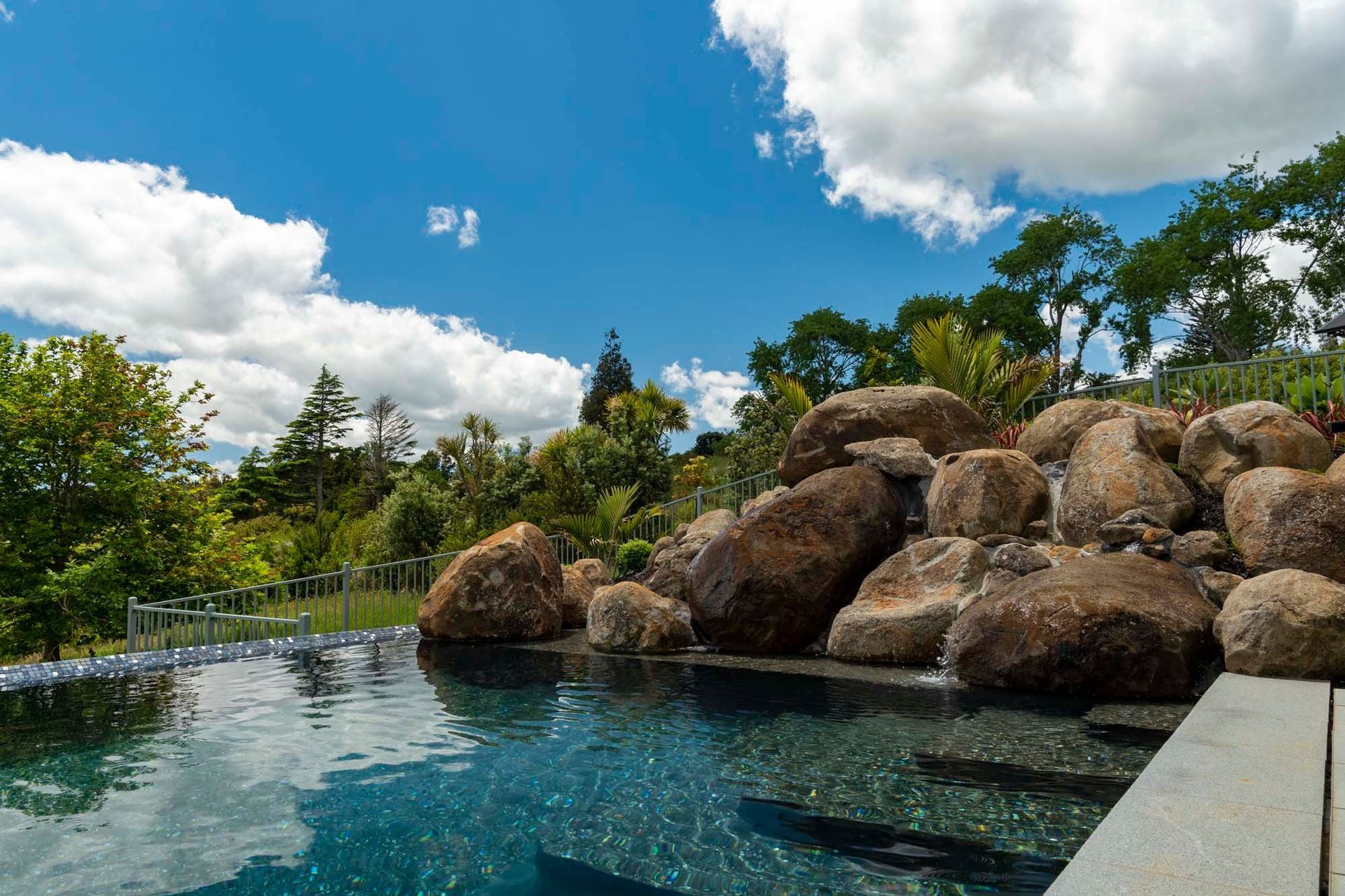 Natural rock pools like this one at Totara Park in South Auckland can be built into your back garden by Auckland Inground Pools.