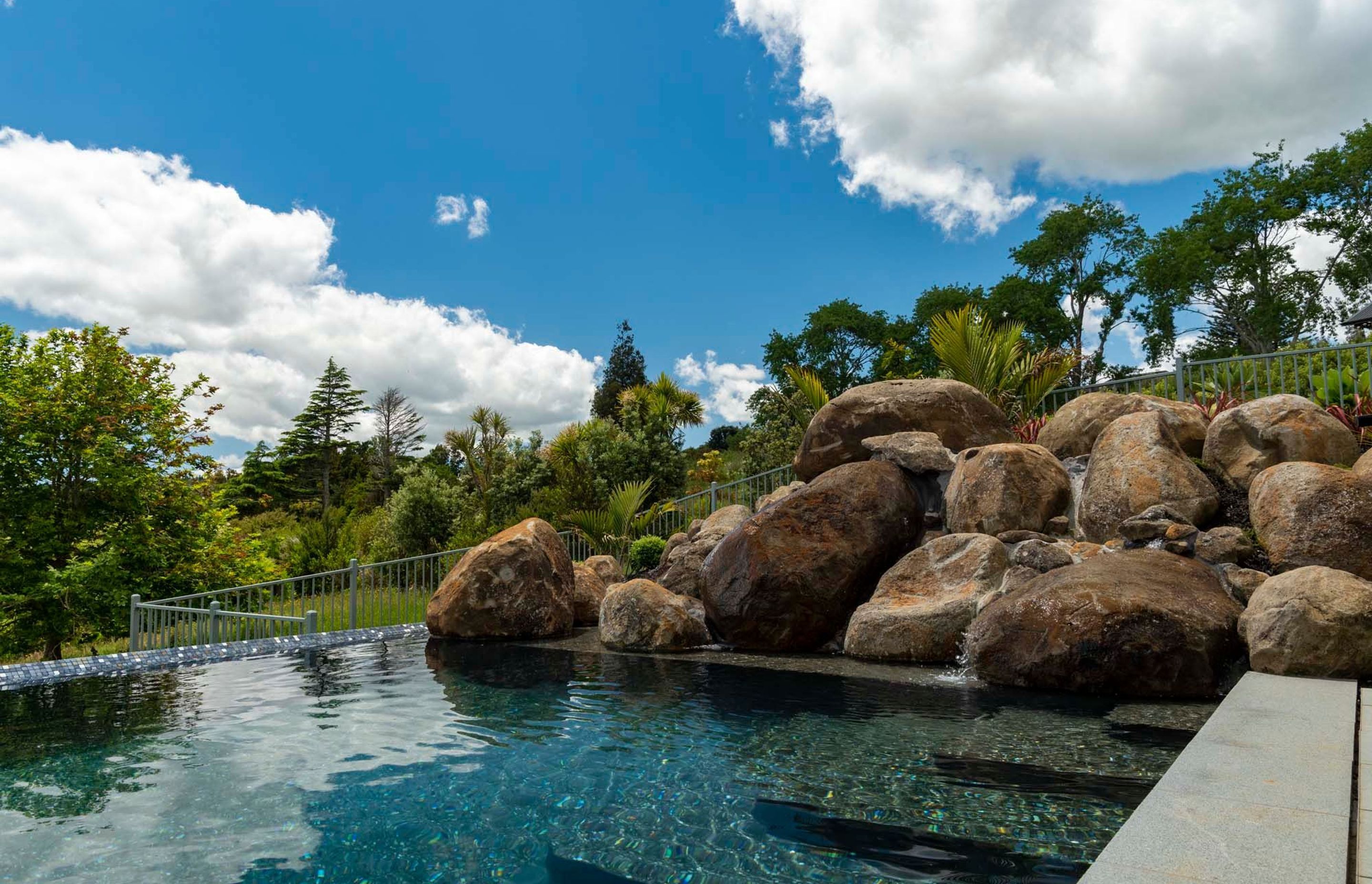 Natural rock pools like this one at Totara Park in South Auckland can be built into your back garden by Auckland Inground Pools.