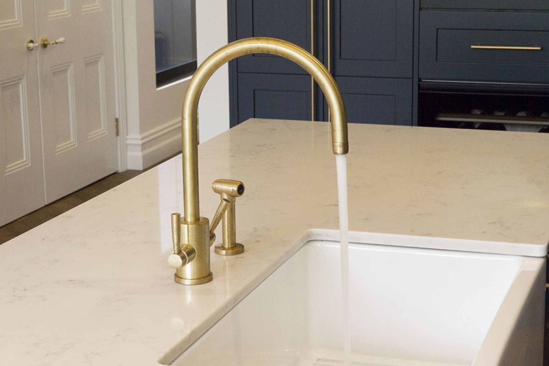 The Orbiq kitchen tap with spray rinse. All tapware can be supplied in Satin or Polished Brass or electroplated in a choice of finish.