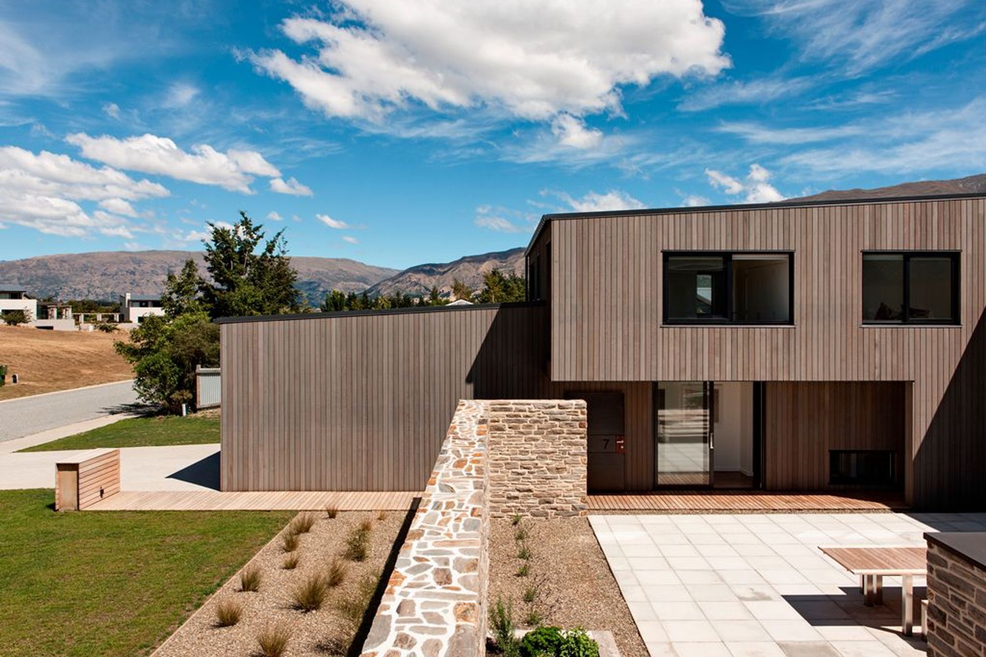 Briar Bank House project by Rafe Maclean Architects uses the INTERSET® Recessed Window Flashing System with vertical cedar cladding