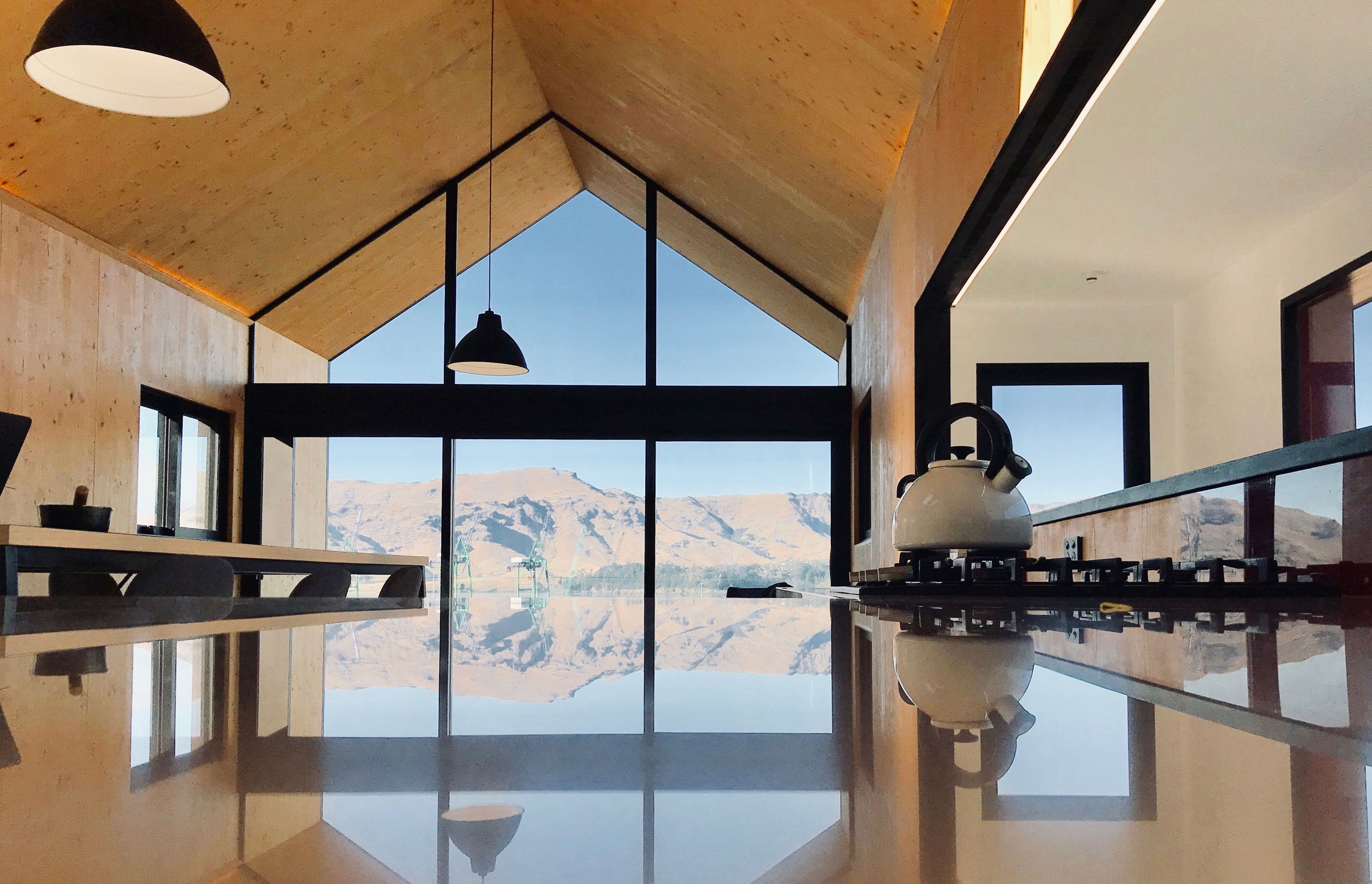 Julie Villard of Bob Burnett Architecture's small 53m² Boat Shed home in Lyttleton has a 9 Homestar rating, and is constructed in CLT with steel portals, wood fibre insulation, rain water harvesting and energy consumption at 36.78 kWh/Y/m².