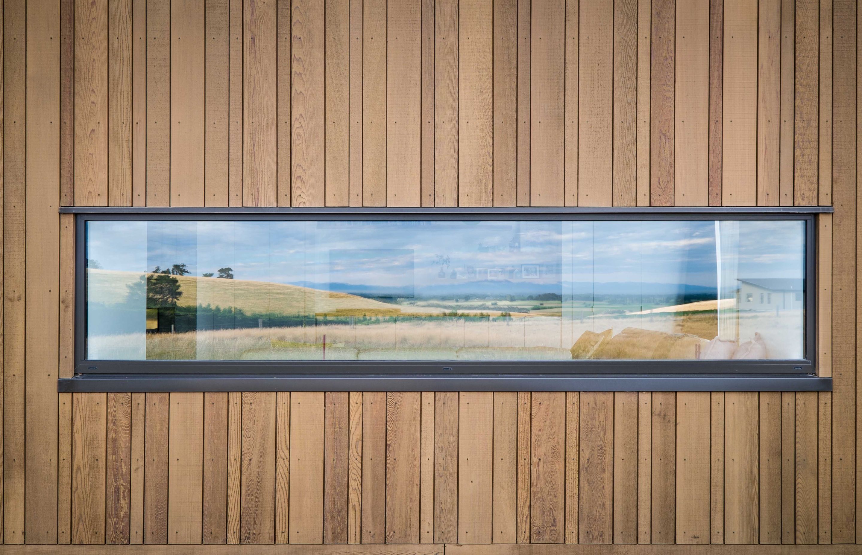 This Dalman Architecture project uses the INTERSET® Recessed Window Flashing System with random width cedar cladding