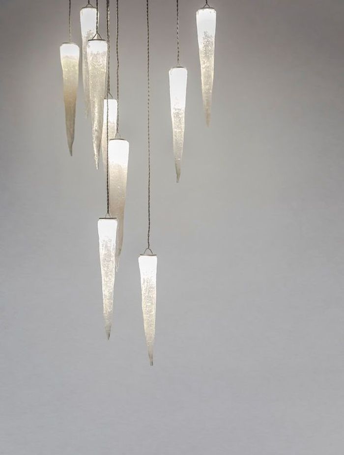 Stalactites: Inspired by a journey through a cave where calcite formations hang, each cast glass form is handcrafted.