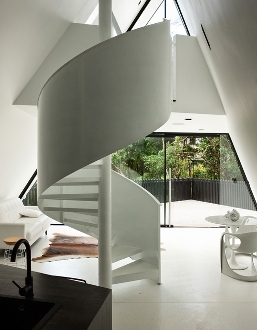 A spiral staircase is a statement feature of Chris Tate's Tent House