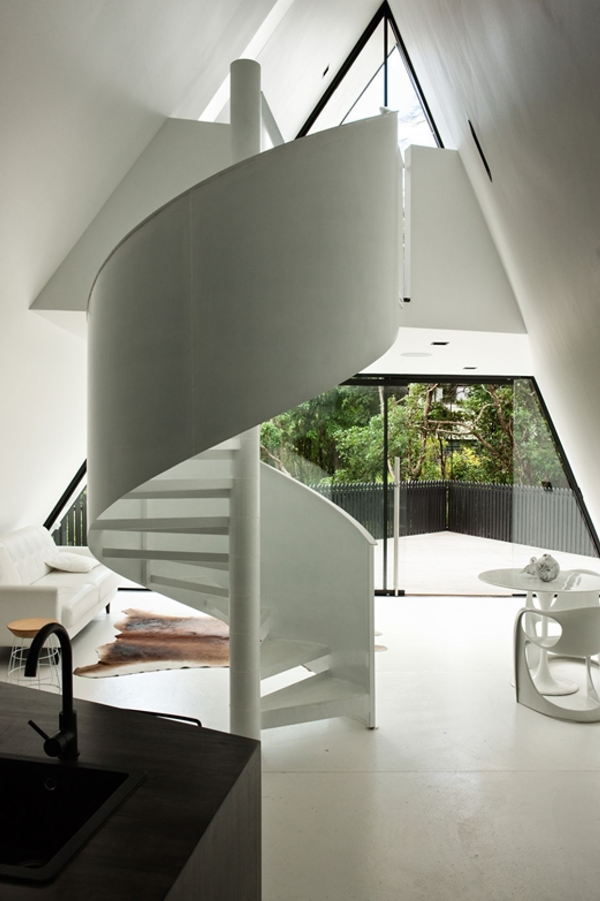 A spiral staircase is a statement feature of Chris Tate's Tent House