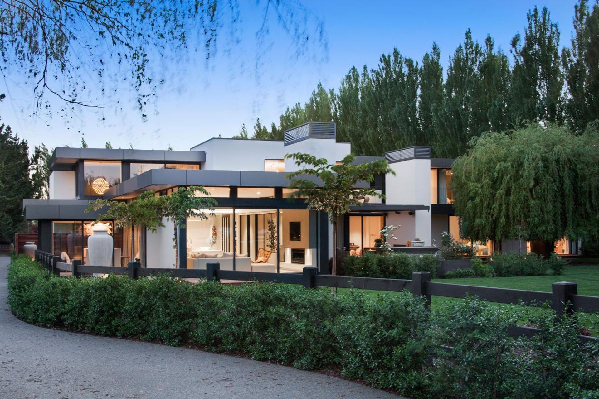 The landscaping at Hills Road House, designed by Outerspace Landscapes utilises established trees to help bed the architecture in with the landscape.