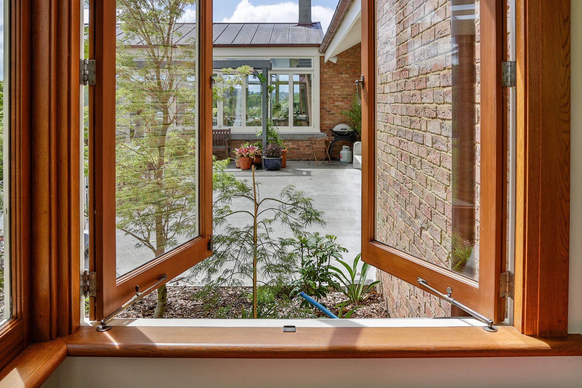 Windsor Brass window accessories finished in oil-rubbed bronze, including telescopic stays (code: 5205-OR), casement fastener (5324-OR) and spring catch (ode: 5194-OR).