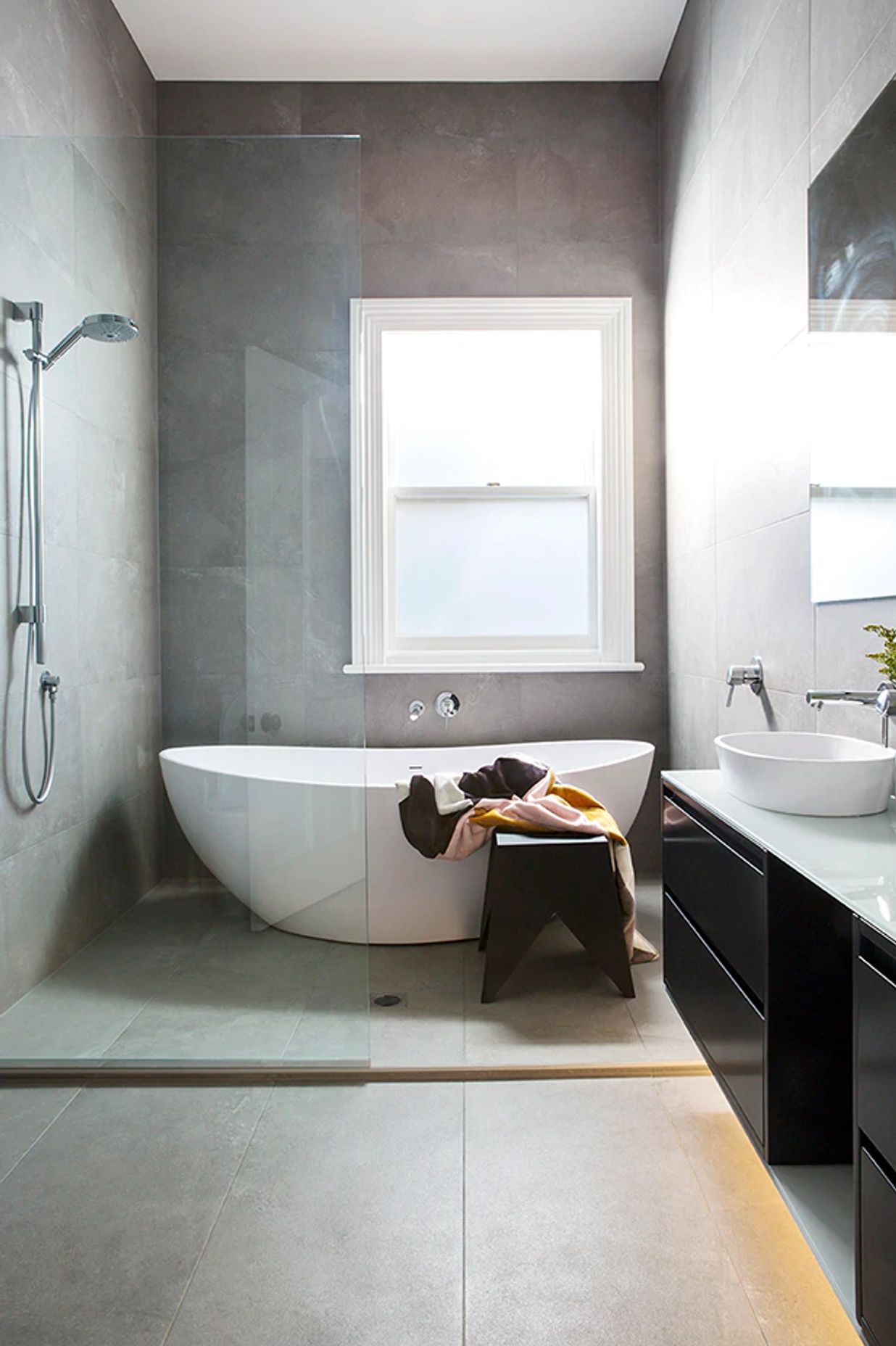 A freestanding tub is the ultimate luxury, but leave enough room around it for cleaning.