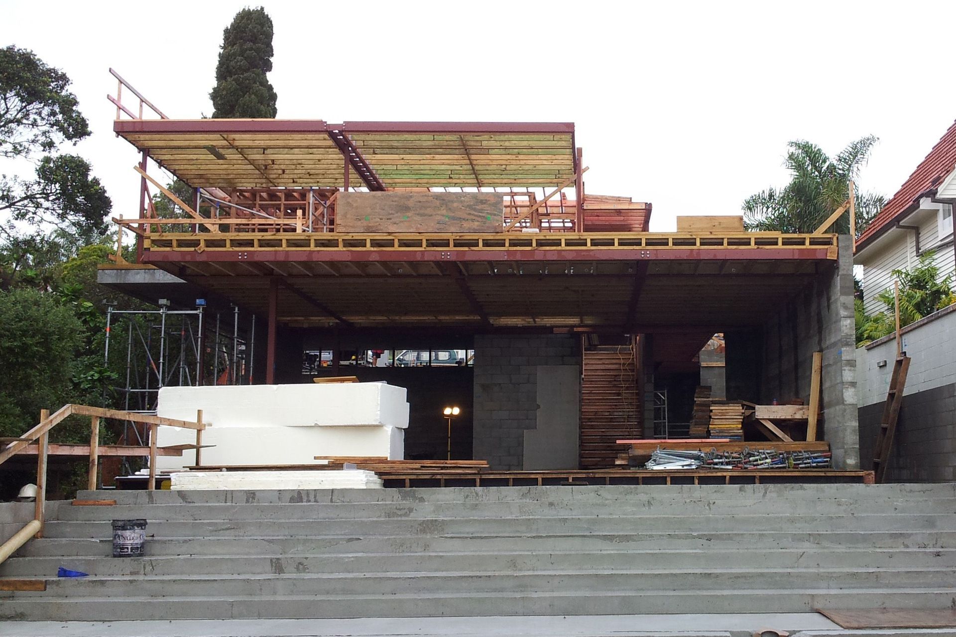 A view of the rear elevation shows the construction of the second-floor structure.