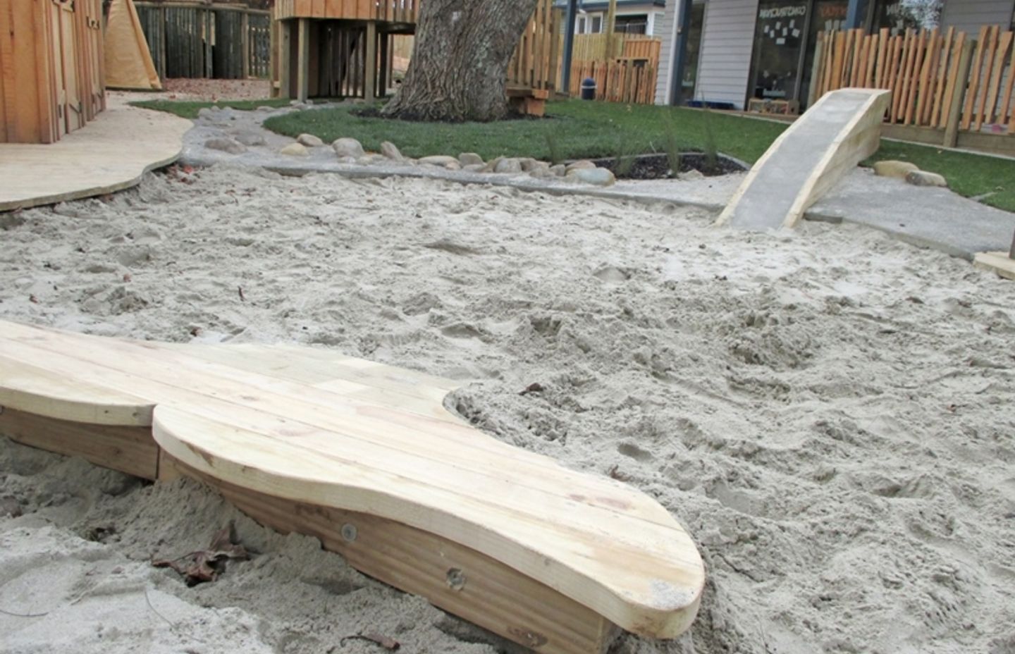A humpback whale lobbing out the sand pit is a playful nod to Pacifica at Glenbrae Kids centre.