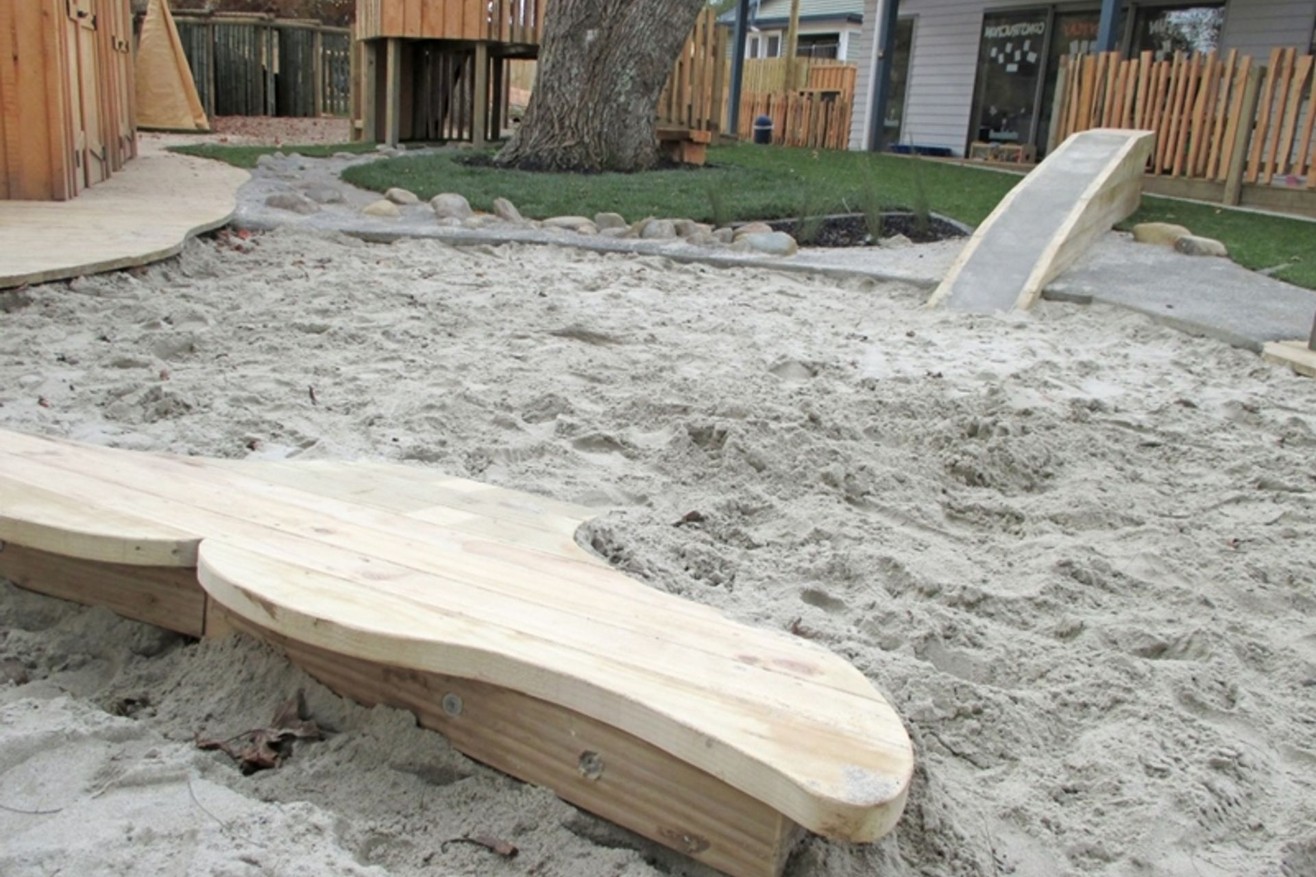 A humpback whale lobbing out the sand pit is a playful nod to Pacifica at Glenbrae Kids centre.