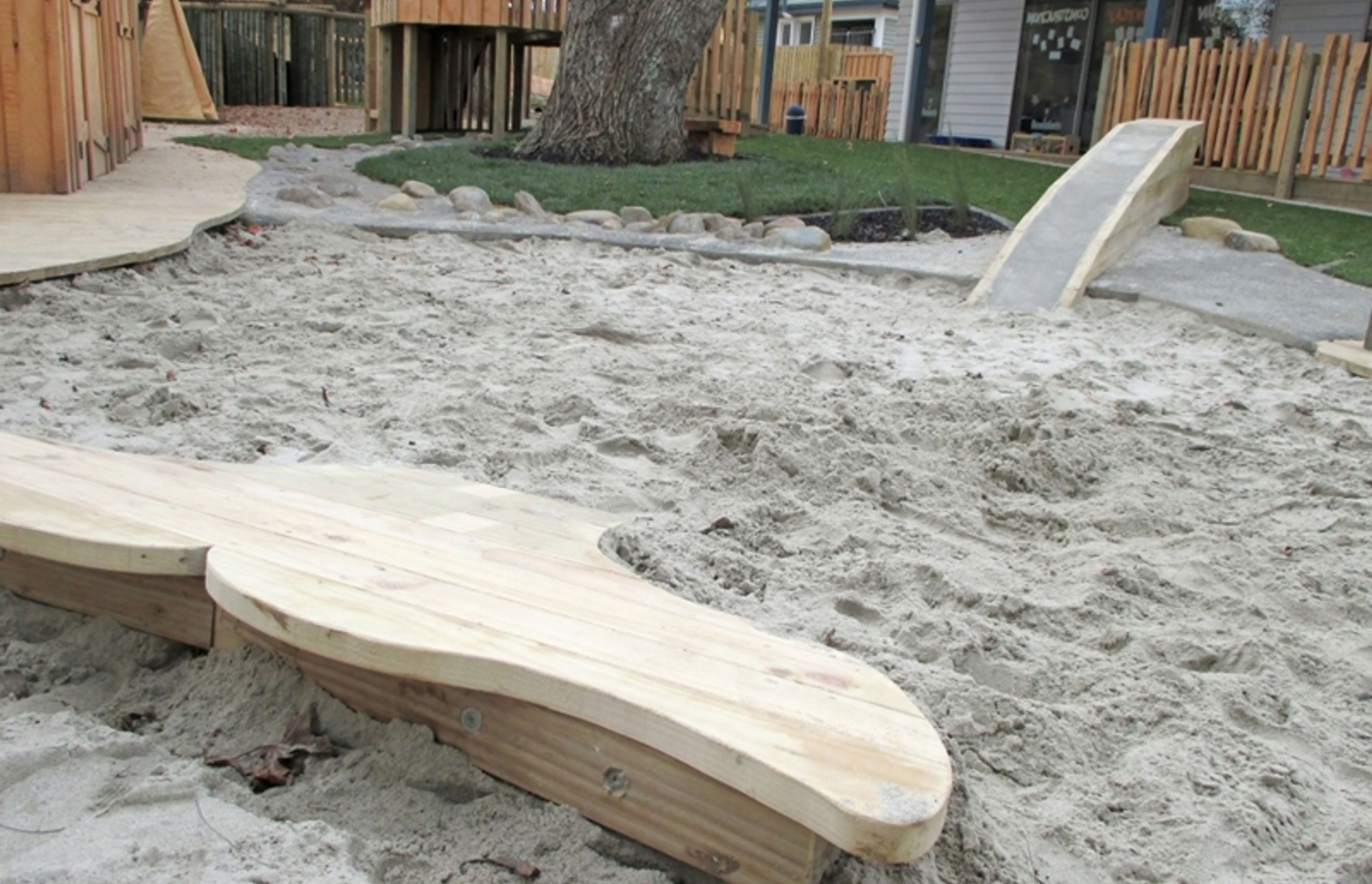 A humpback whale lobbing out the sand pit is a playful nod to Pacifica at Glenbrae Kids centre.
