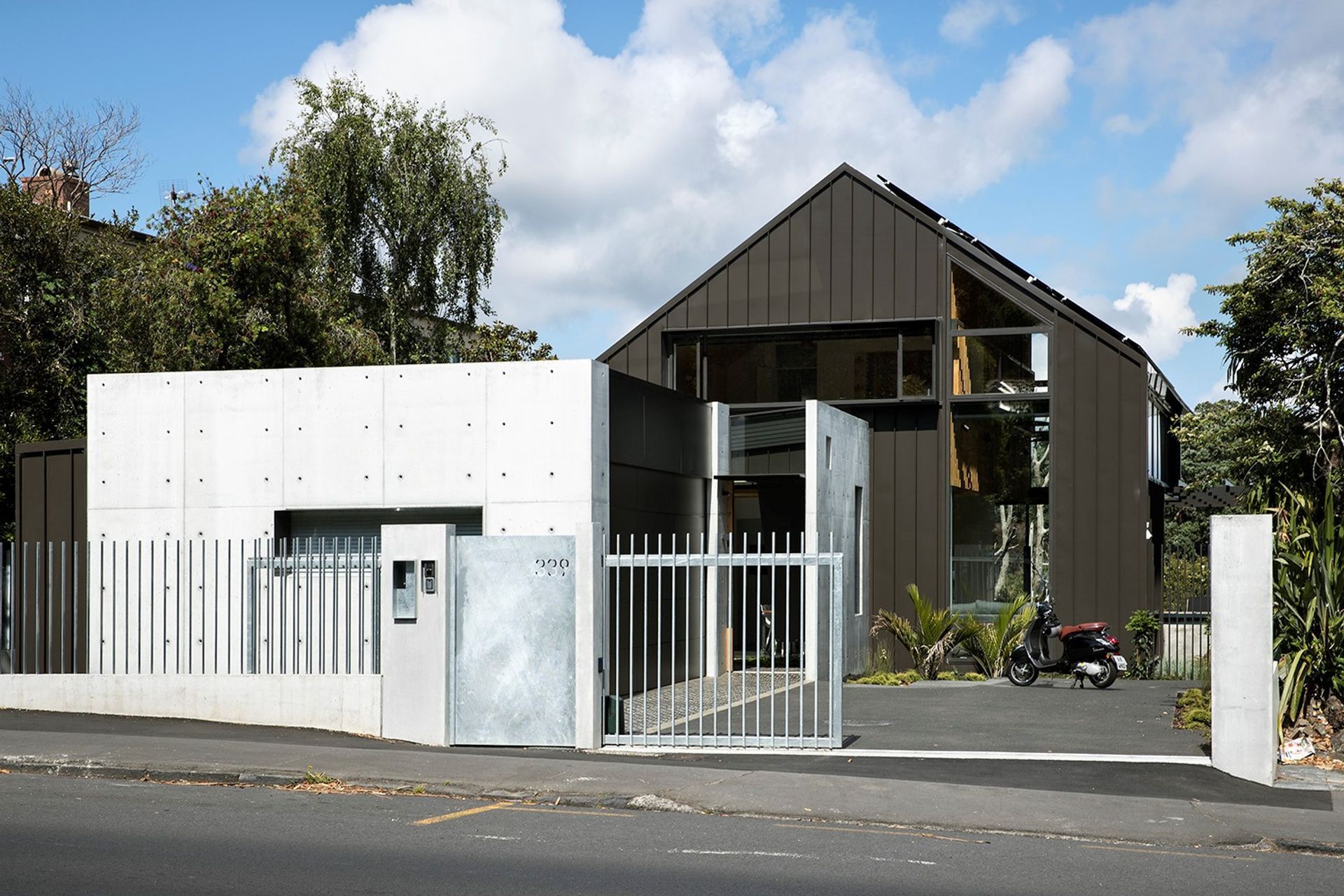 339 is situated on a busy road with constant diesel fumes, so utilises robust materials such as in-situ concrete, galvanised steel and easy wash-down Colorsteel cladding. By Strachan Group Architects. Photo by Simon Devitt.