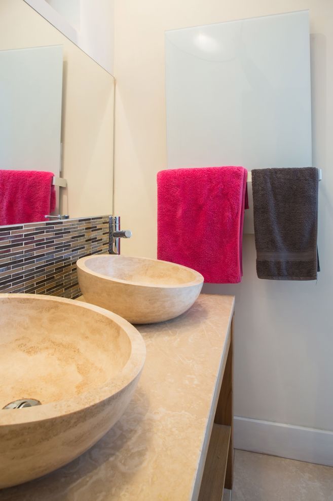 Infrared mirror heater panels keep bathroom walls and fittings warm, dry and free of mould.