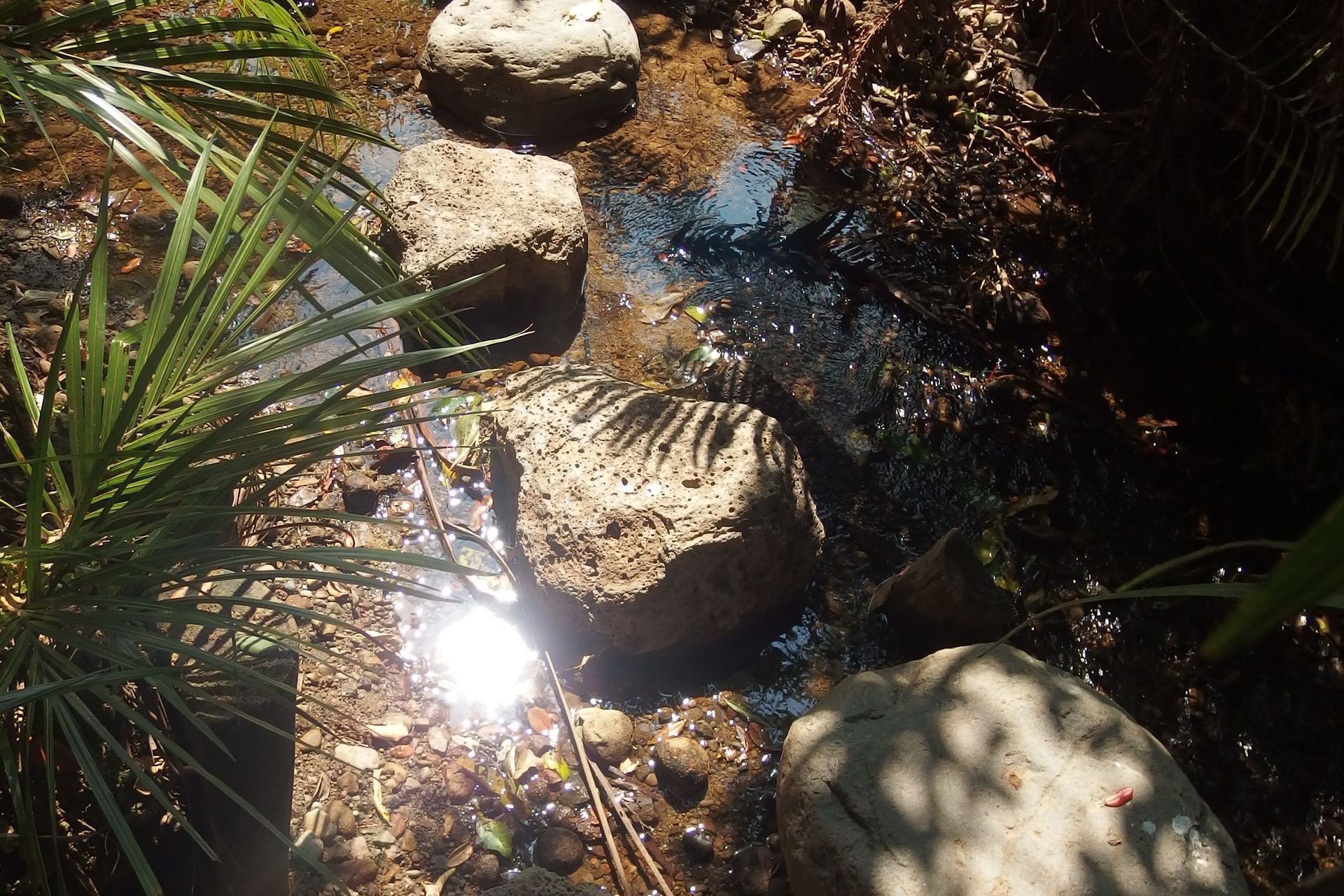 A derelict stream bridge was replaced with a simple crossing of natural boulders
