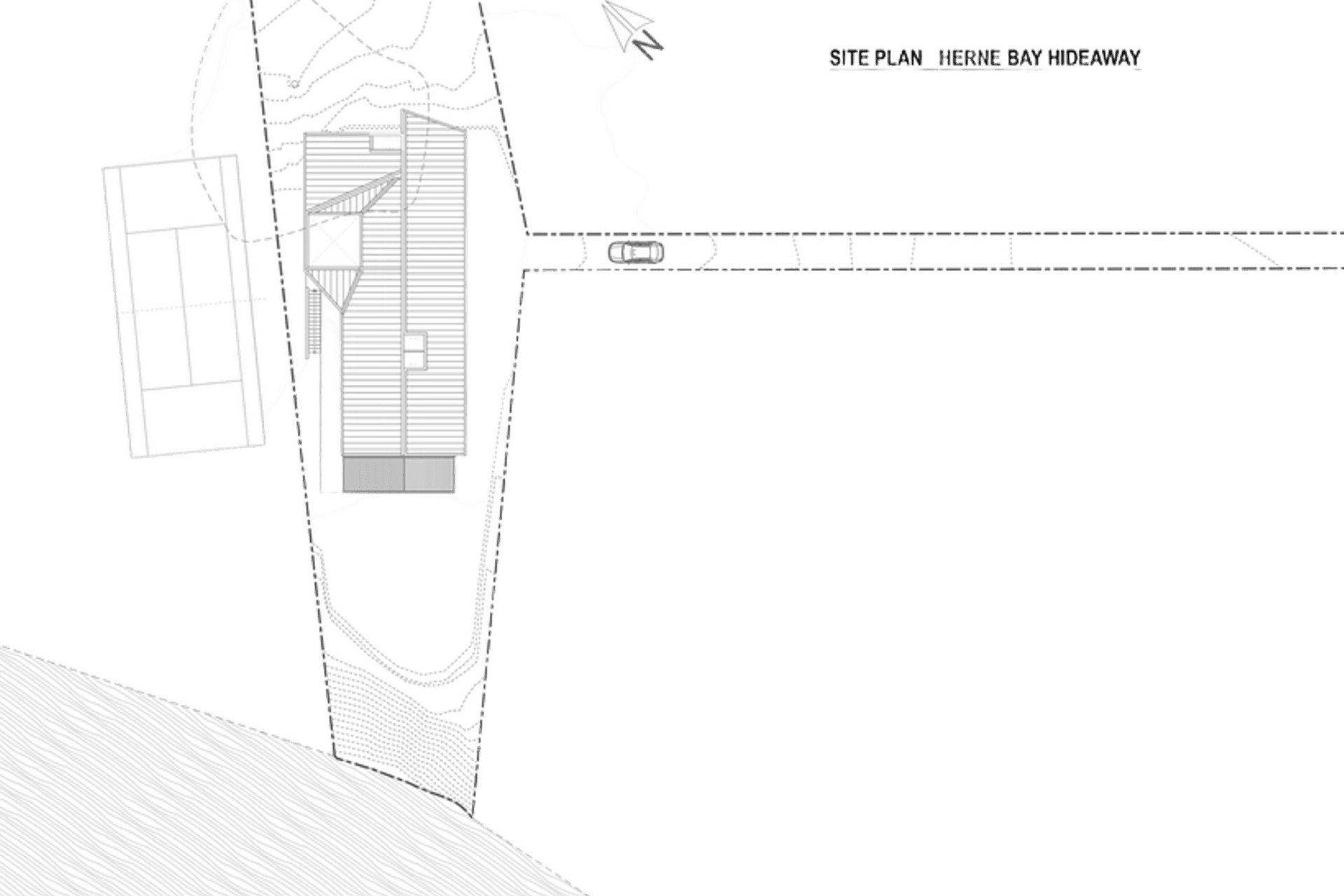 Site plan by Lloyd Hartley Architects indicates the tennis court on the left and the 75m-long driveway on the right.