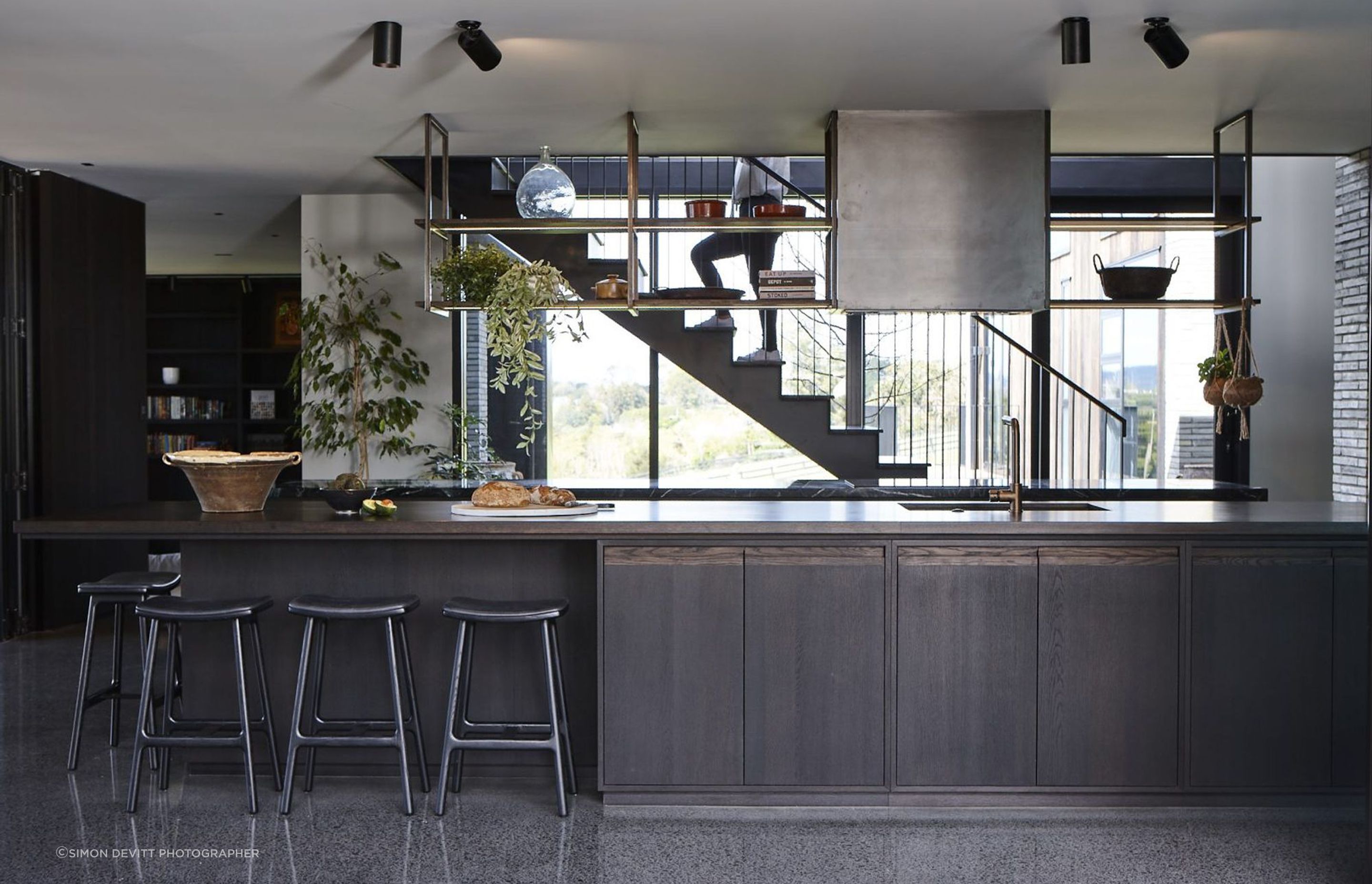 Two five-metre benchtops make up the kitchen, conceived as two elemental forms; one in marble the other in timber.
