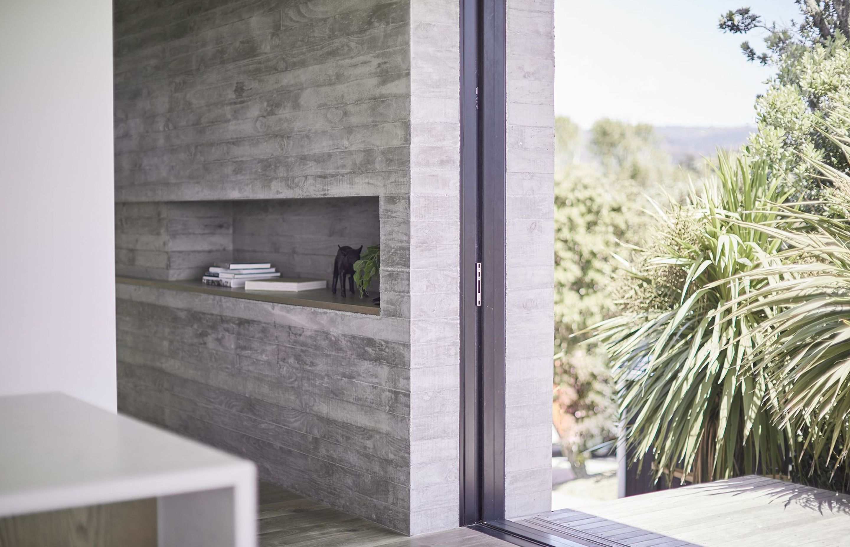 The first of the three interior in situ concrete features is on the western elevation and doubles as both a structural wall and a method of completely concealing three doors and two screens when opened.